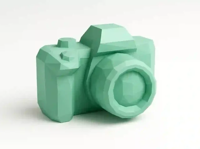 Mint-green low-poly 3D camera model on white background — stylized render showcasing open-source image generator capabilities (2025)